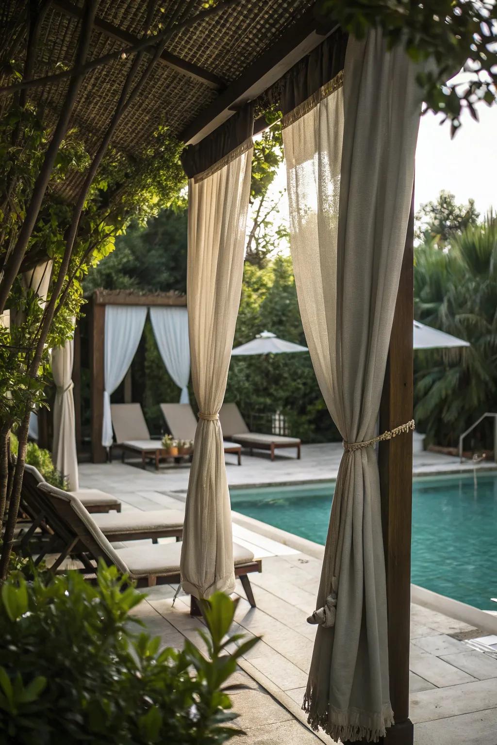 Outdoor curtains provide flexible privacy options for this inviting pool area.
