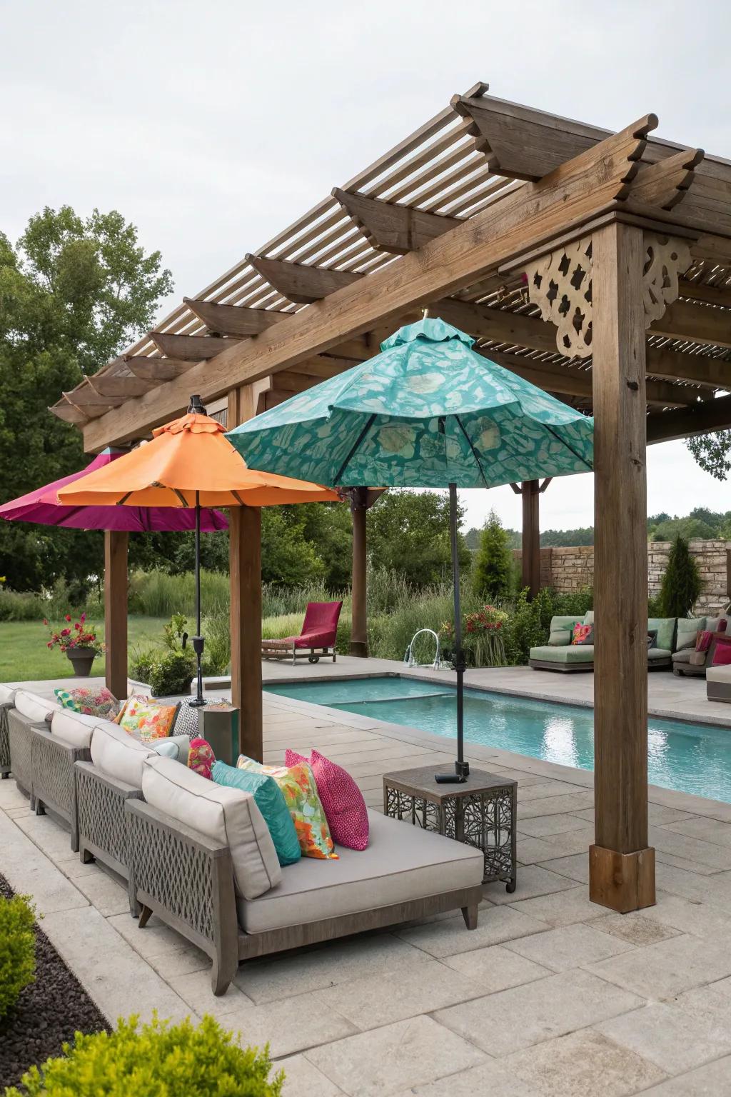 Umbrellas and a pergola offer shade and privacy, creating a cozy poolside retreat.