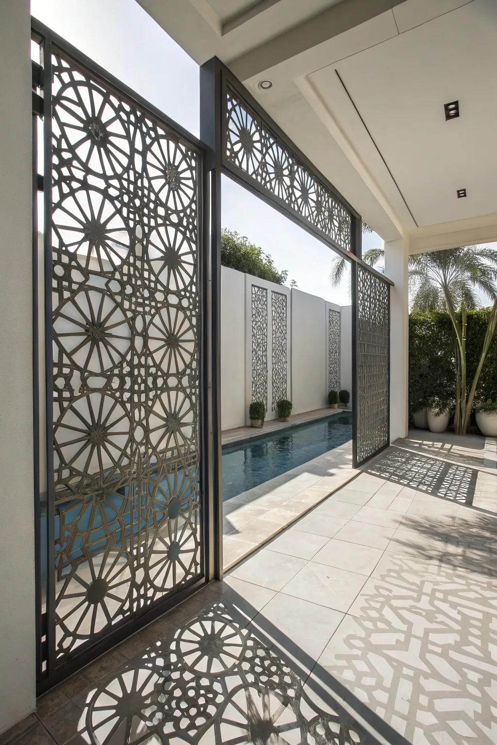 Geometric metal screens add a modern flair and privacy to any pool space.