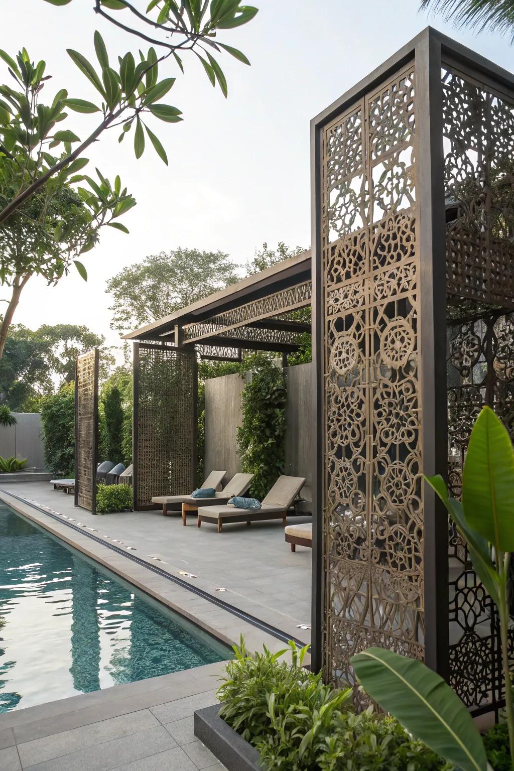 Decorative metal panels add an artistic touch to pool privacy.