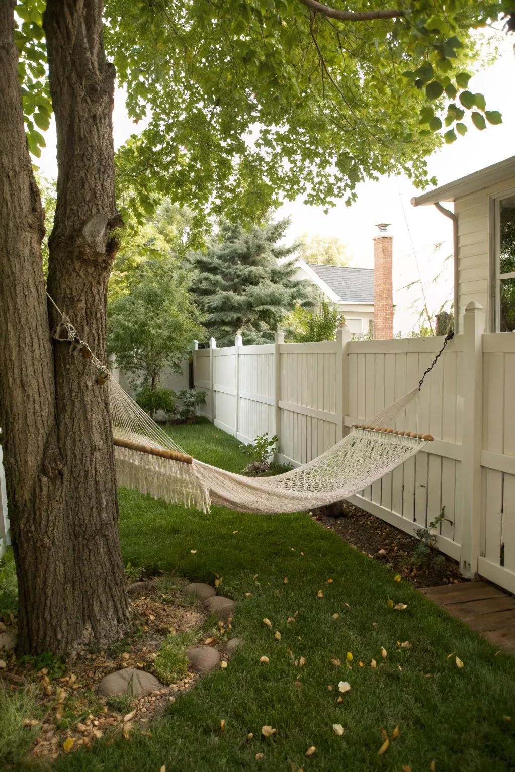 A hammock offers a perfect spot for relaxation in a small backyard.