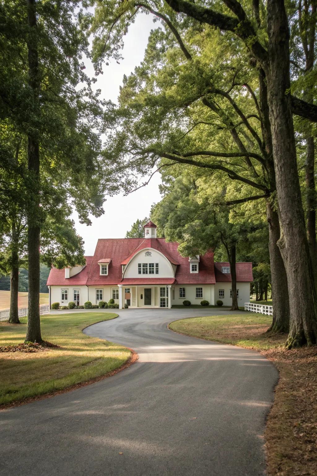 A sophisticated circular driveway in front of a charming farmhouse.
