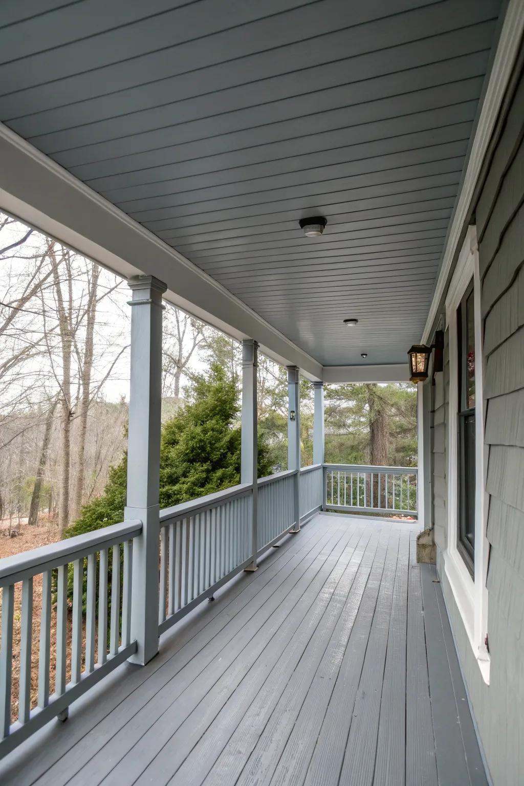 A gray ceiling adds a cozy feel to the porch.