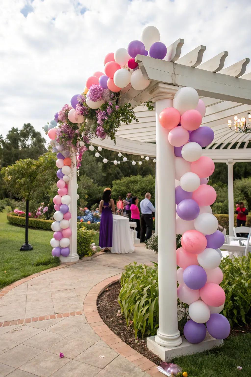 A pergola with a playful display of colorful balloons.