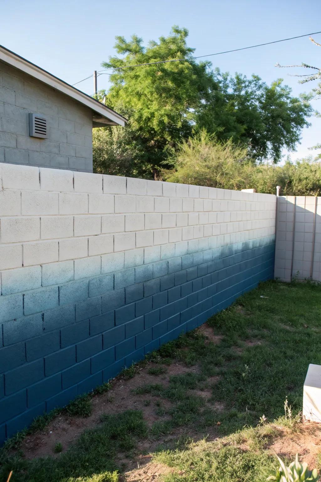 A stunning ombre effect on a backyard cinder block wall.