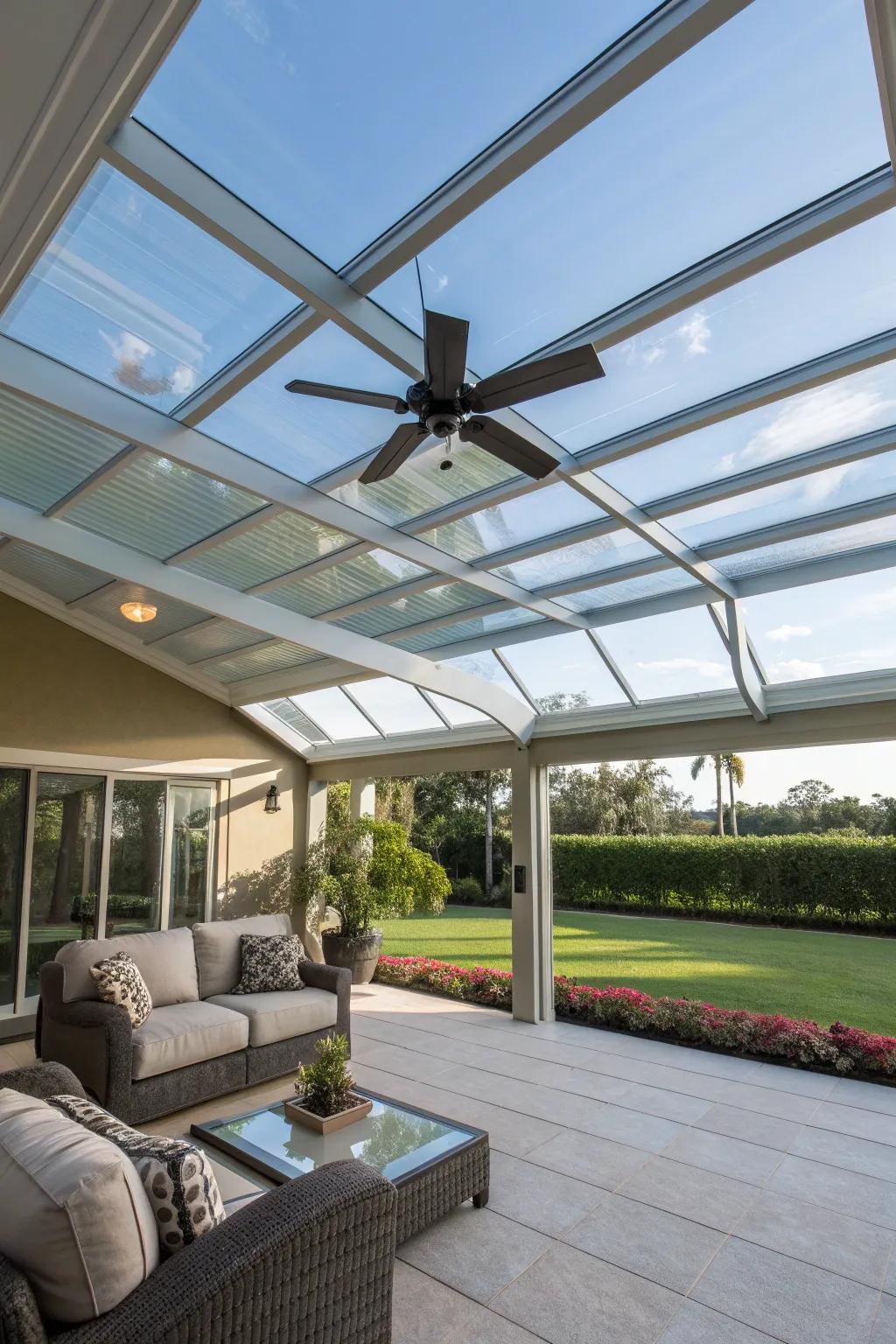 A glass patio cover equipped with a fan for cooling comfort.