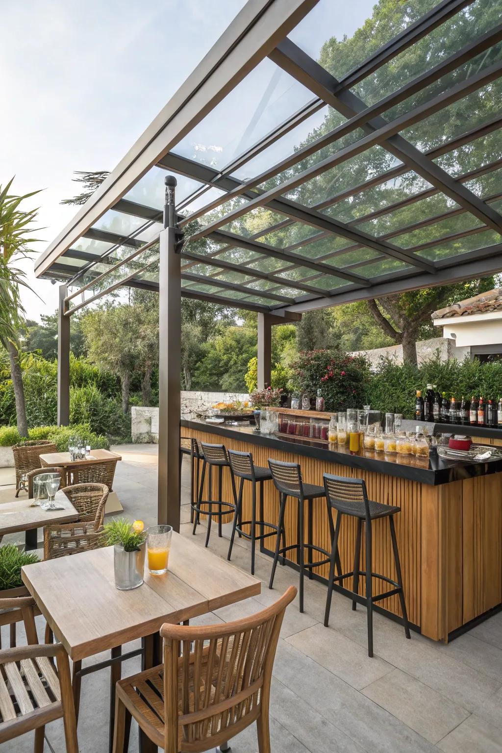 A glass patio cover surrounded by lush greenery.