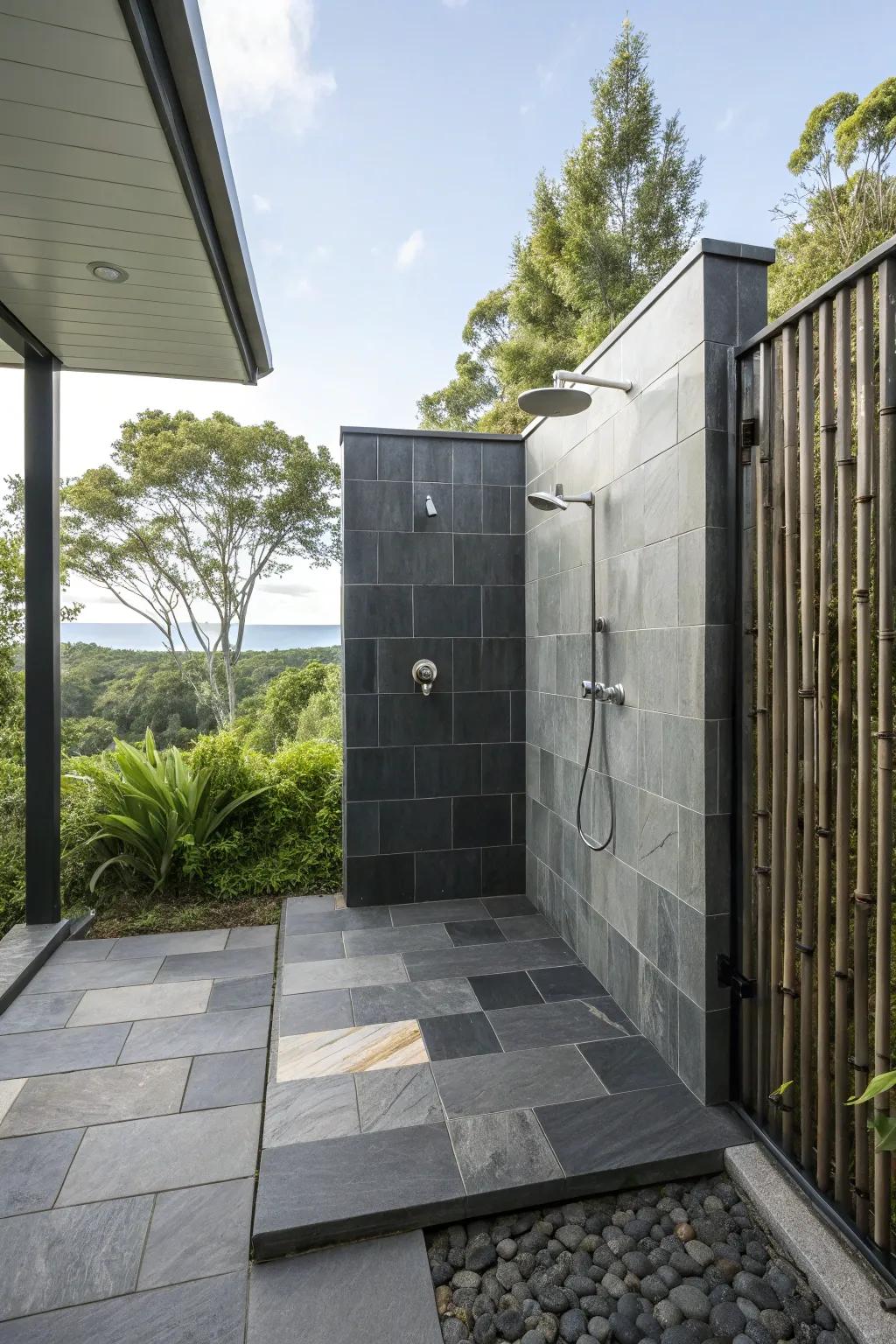 Slate tiles offer a sleek, sophisticated look for outdoor showers.
