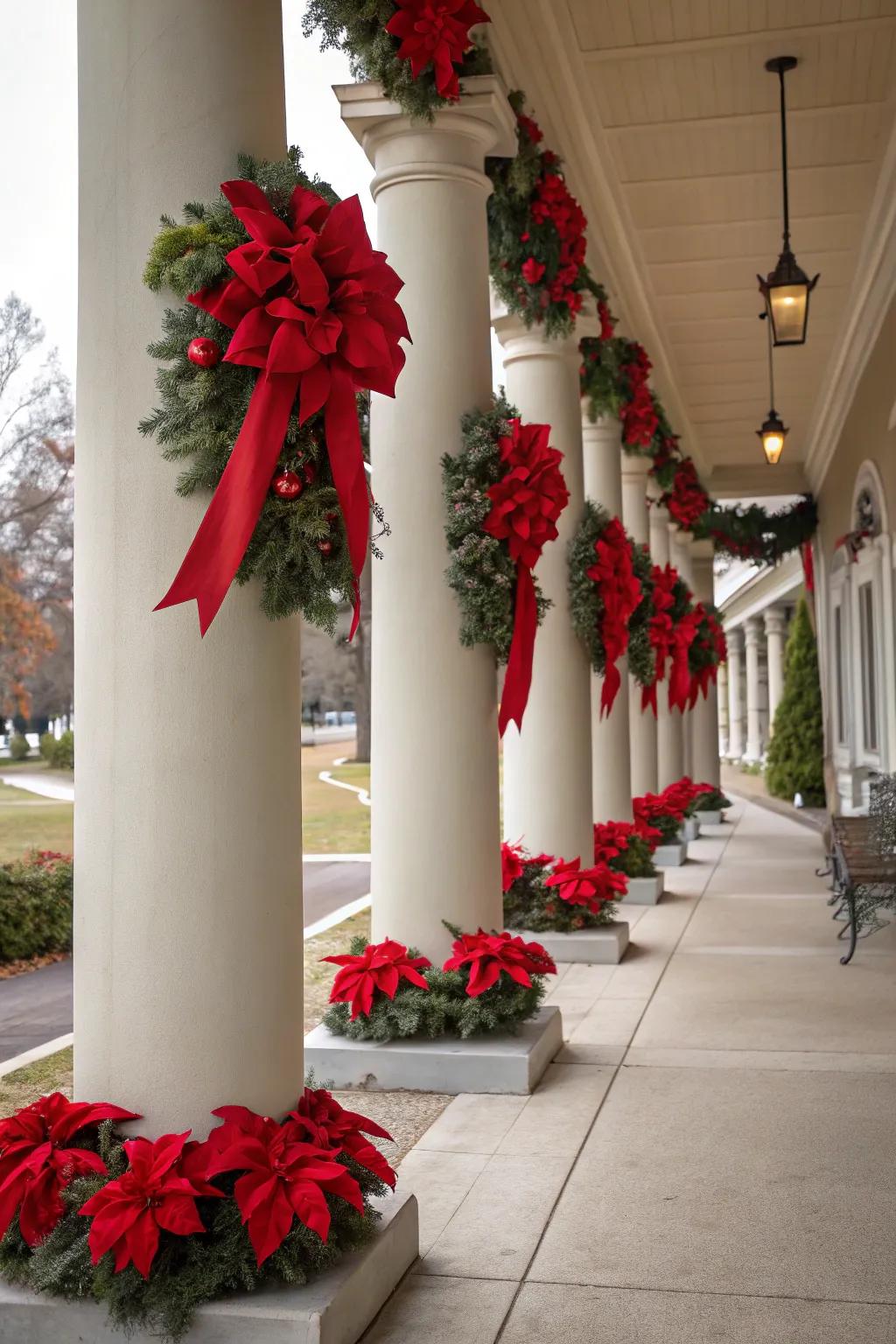 Vibrant poinsettias and red bows adorn these festive columns.
