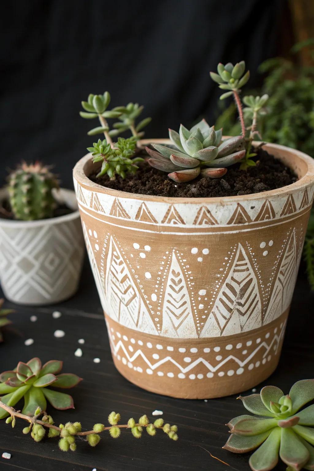 A rustic flower pot featuring traditional mud cloth designs.