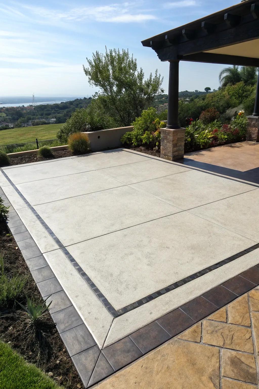 A concrete patio with a contrasting dark border that frames the space.