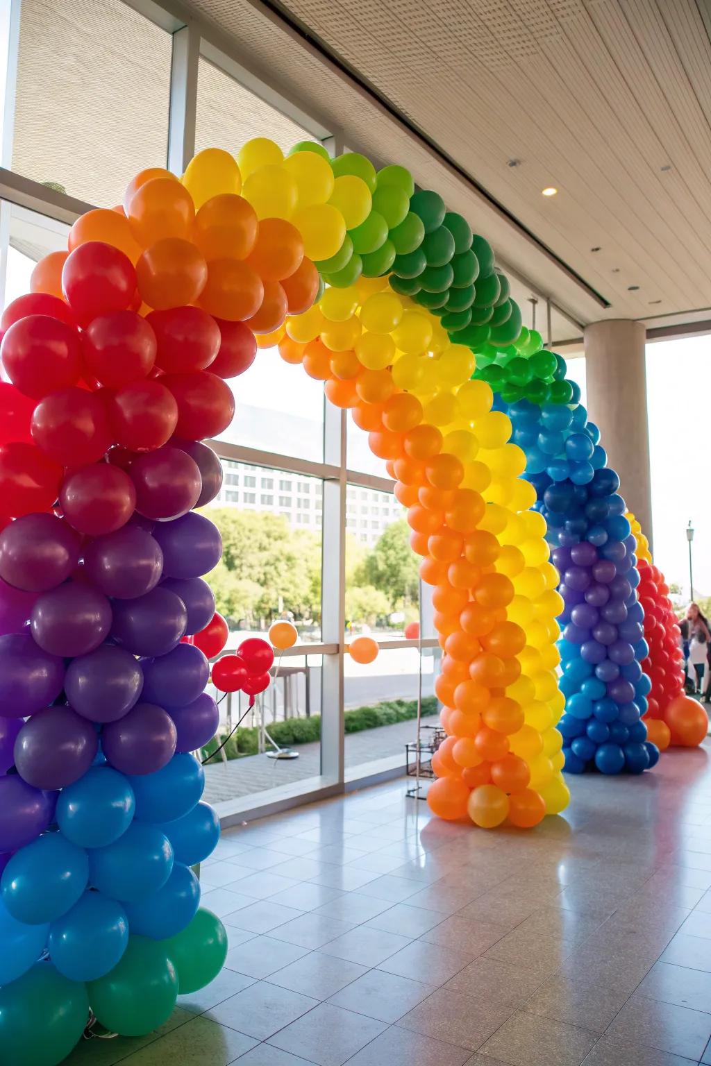 A joyful rainbow balloon arch celebrating diversity.