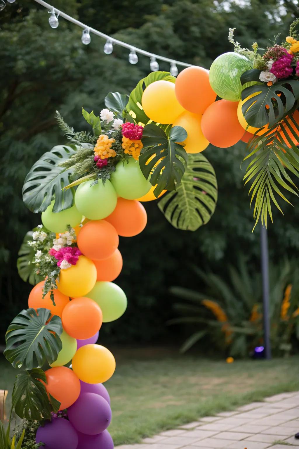 A vibrant tropical balloon arch for a summer vibe.