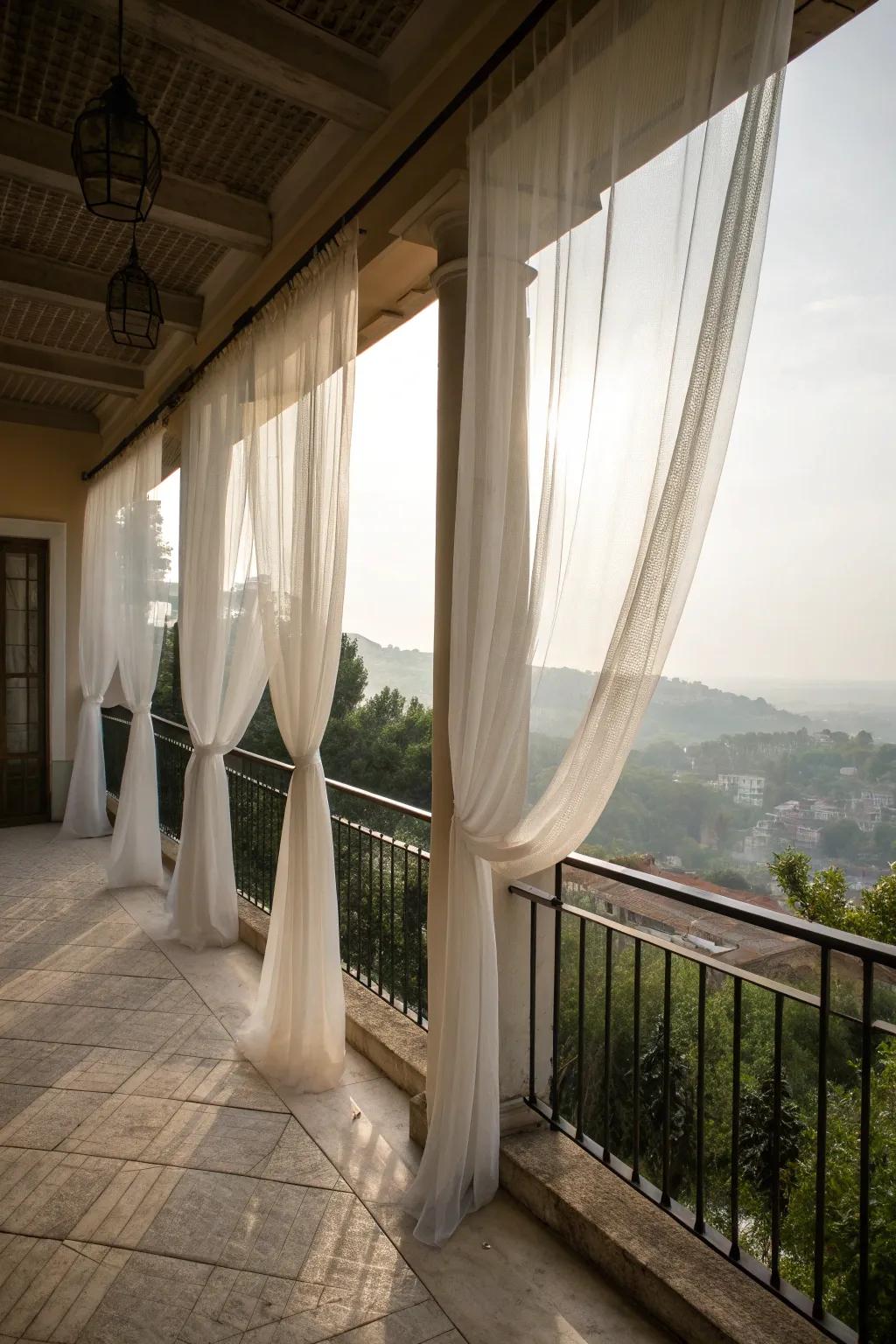 Sheer drapes add privacy and elegance to a balcony.