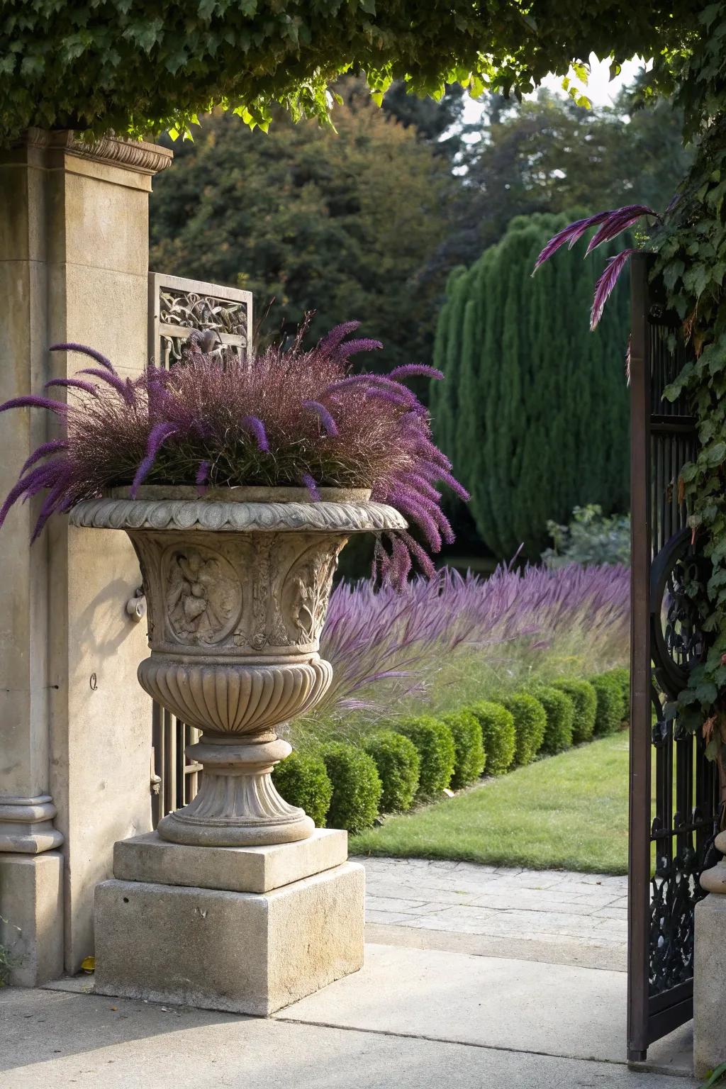 An ornate urn adds elegance to purple fountain grass displays.