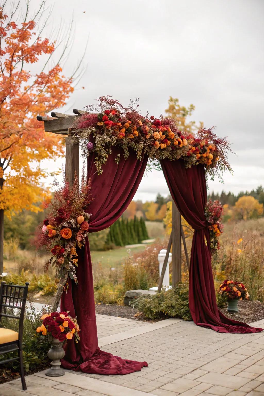Luxurious drapery transforms this arch into a fall masterpiece.