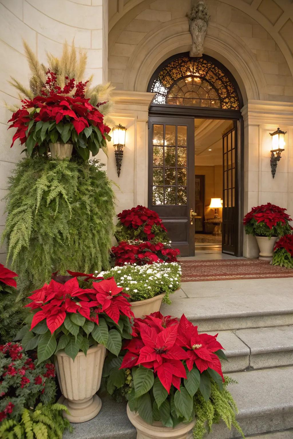 A grand entrance adorned with poinsettias and greenery.