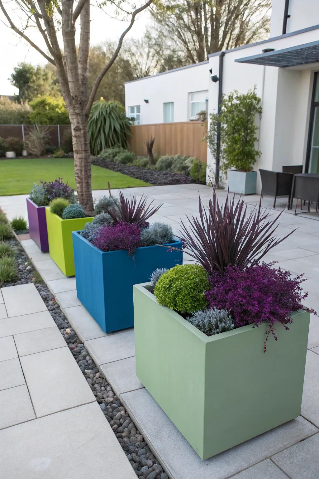 Make a modern statement with geometric planters and bold plants.