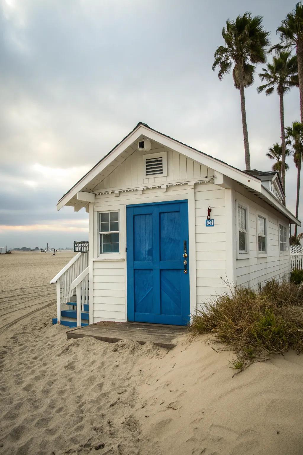 A beach house with a striking nautical blue front door.