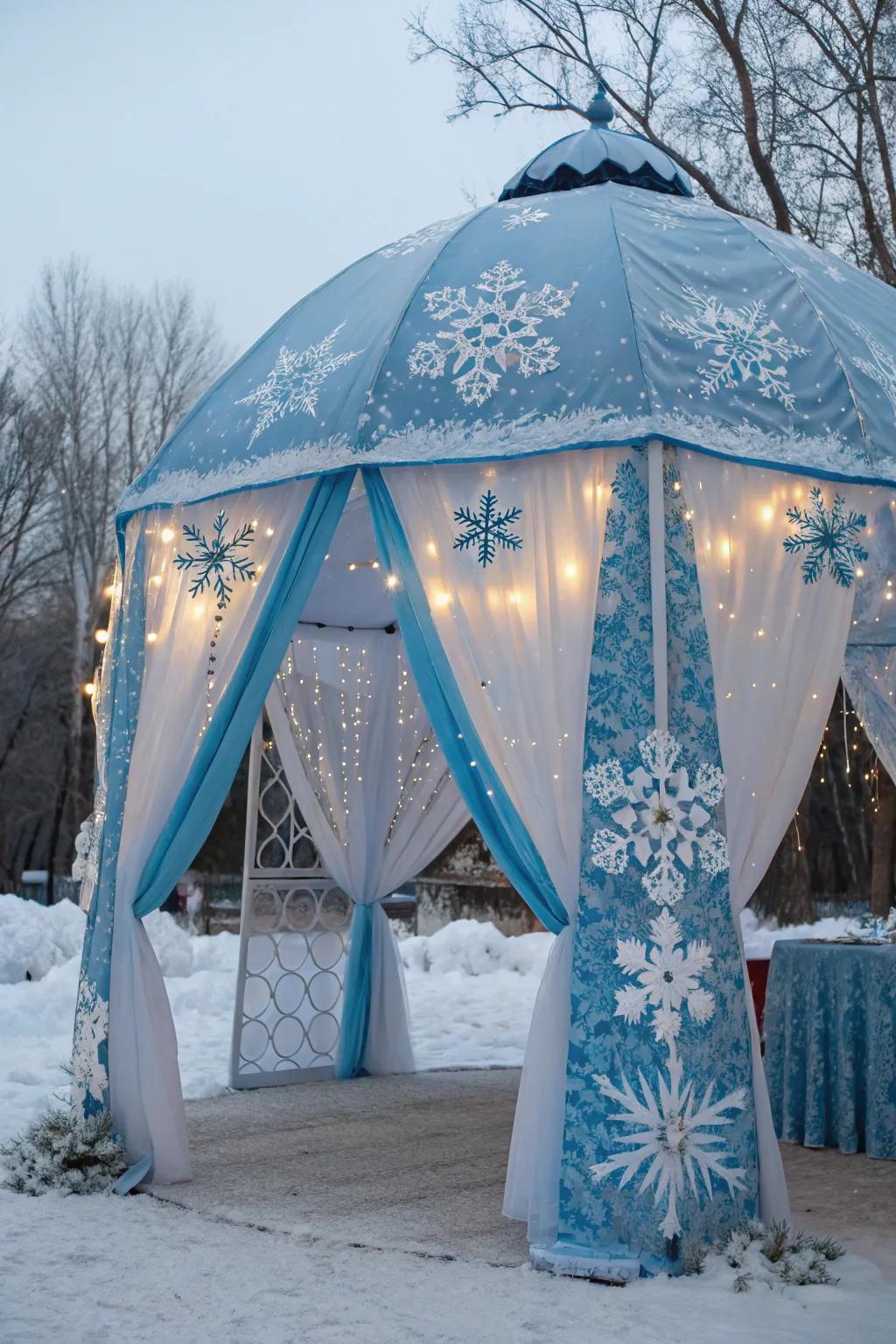 A tent interior transformed into a winter wonderland with icy blue and white decorations.
