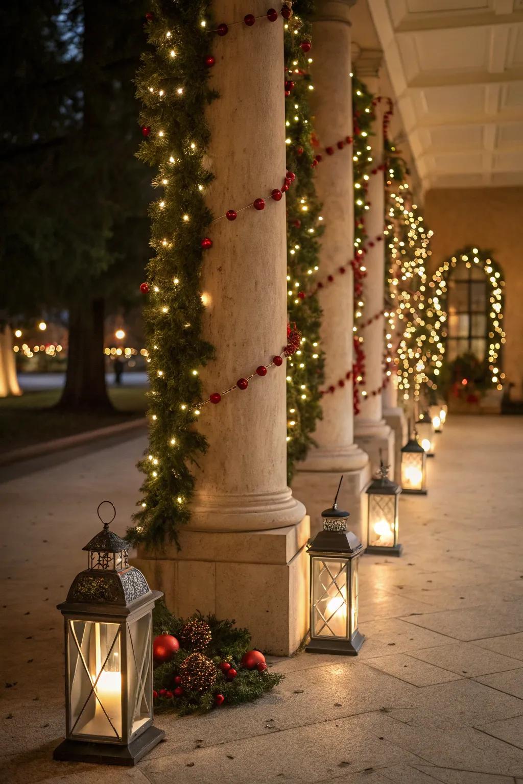 Lanterns at the base create a warm glow for these holiday columns.