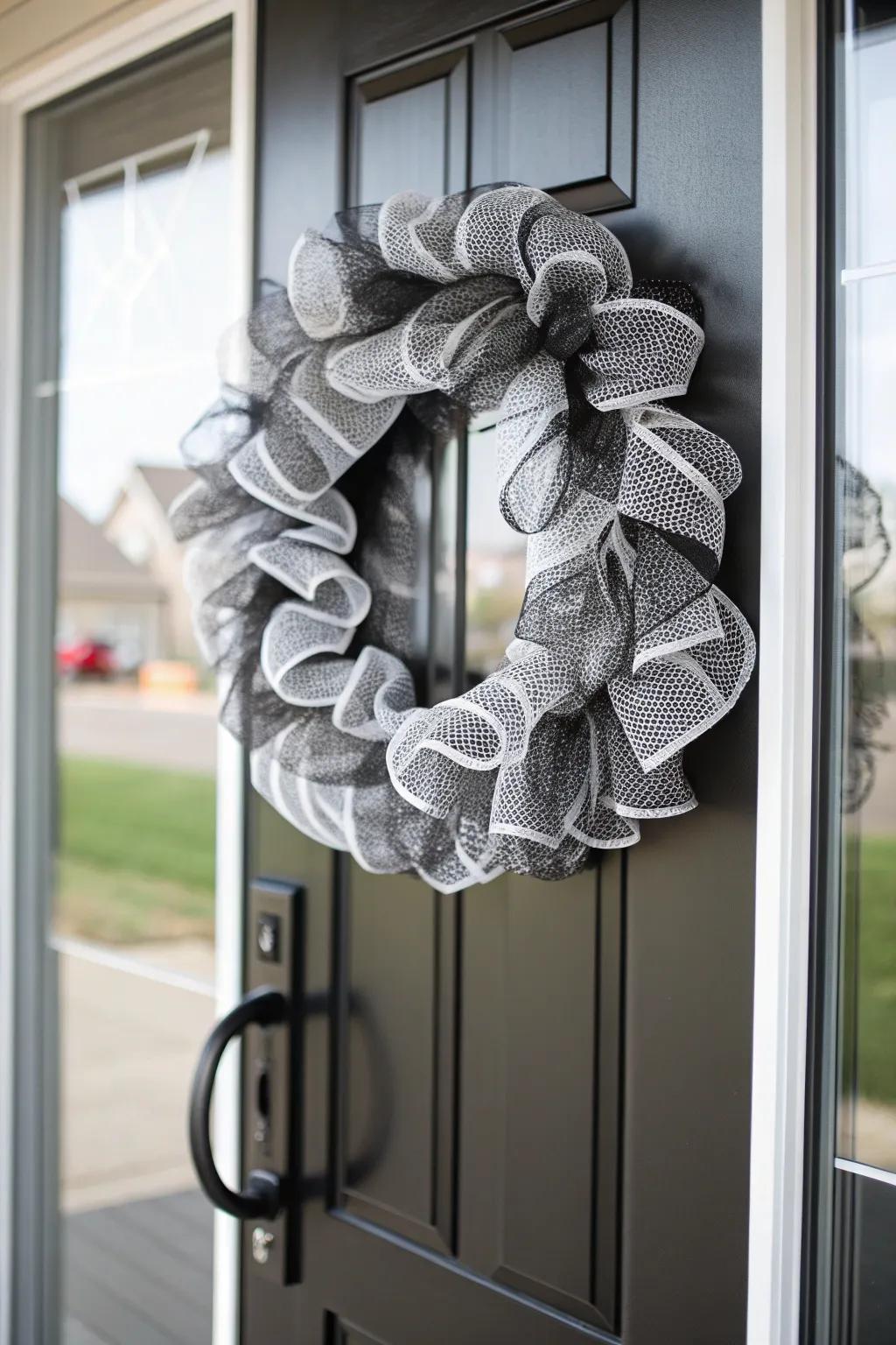 A sophisticated monochrome mesh wreath for elegant decor.