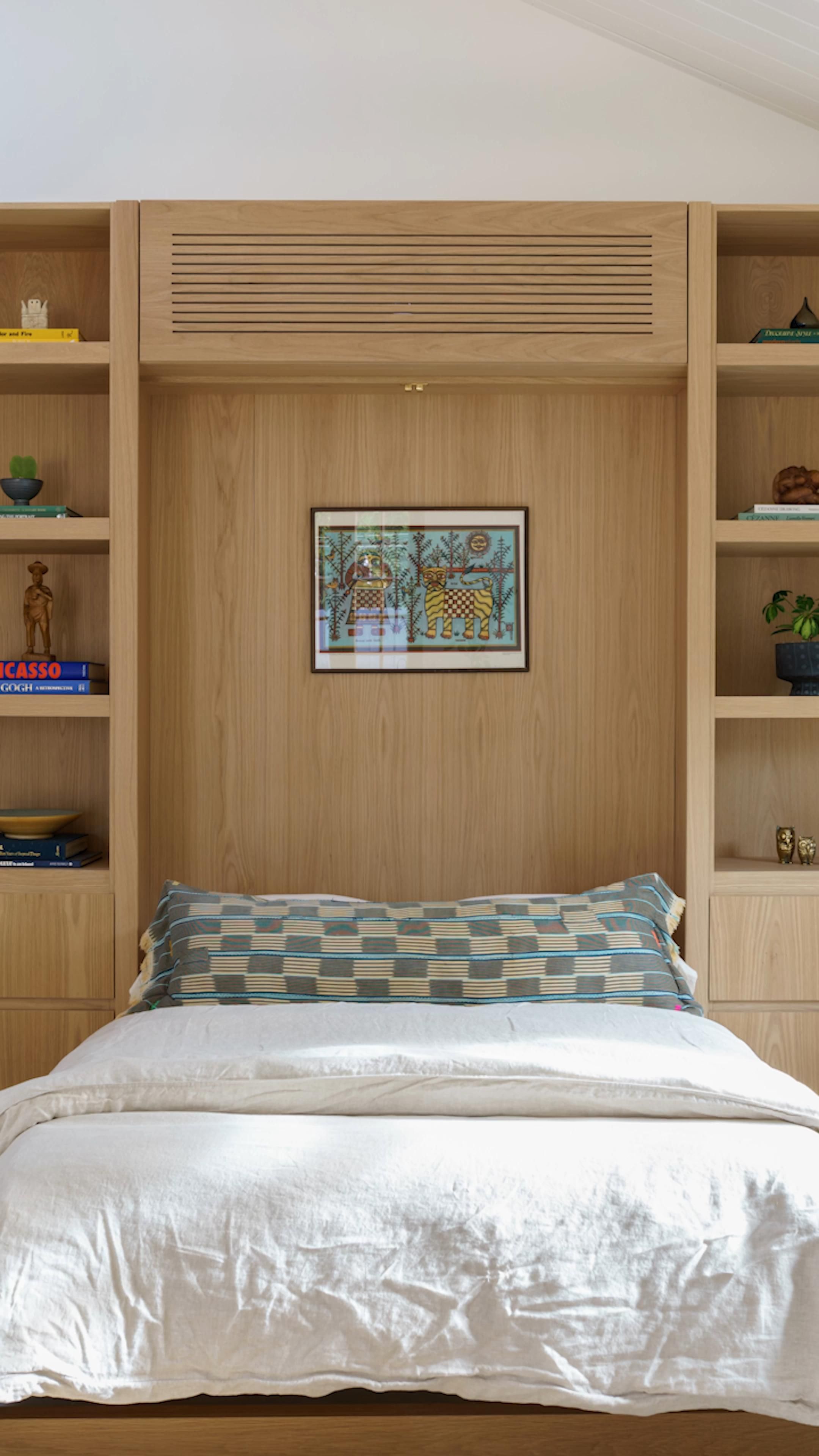 Oak-Wood Handles and Faux Drawers Are Murphy Bed Camouflage in This Guesthouse