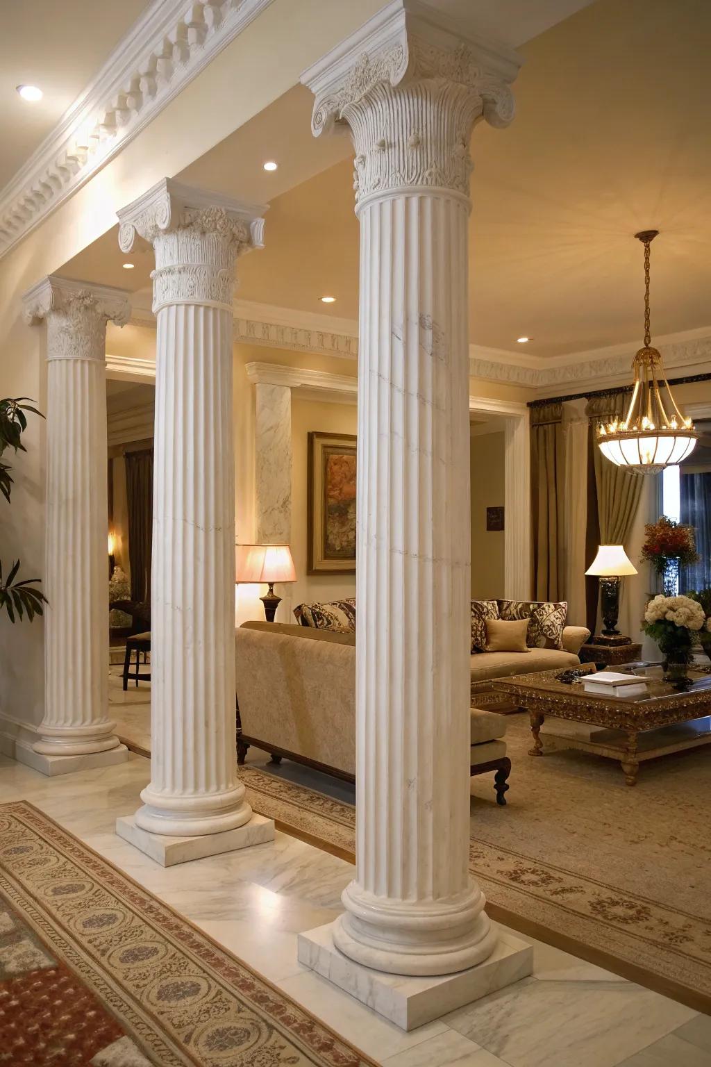 White marble grooved pillars adding classic elegance to a modern living room.