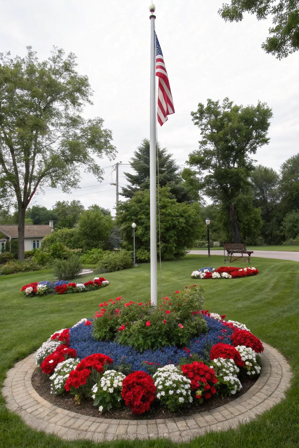 A colorful circular flower bed around a flagpole, celebrating patriotism.