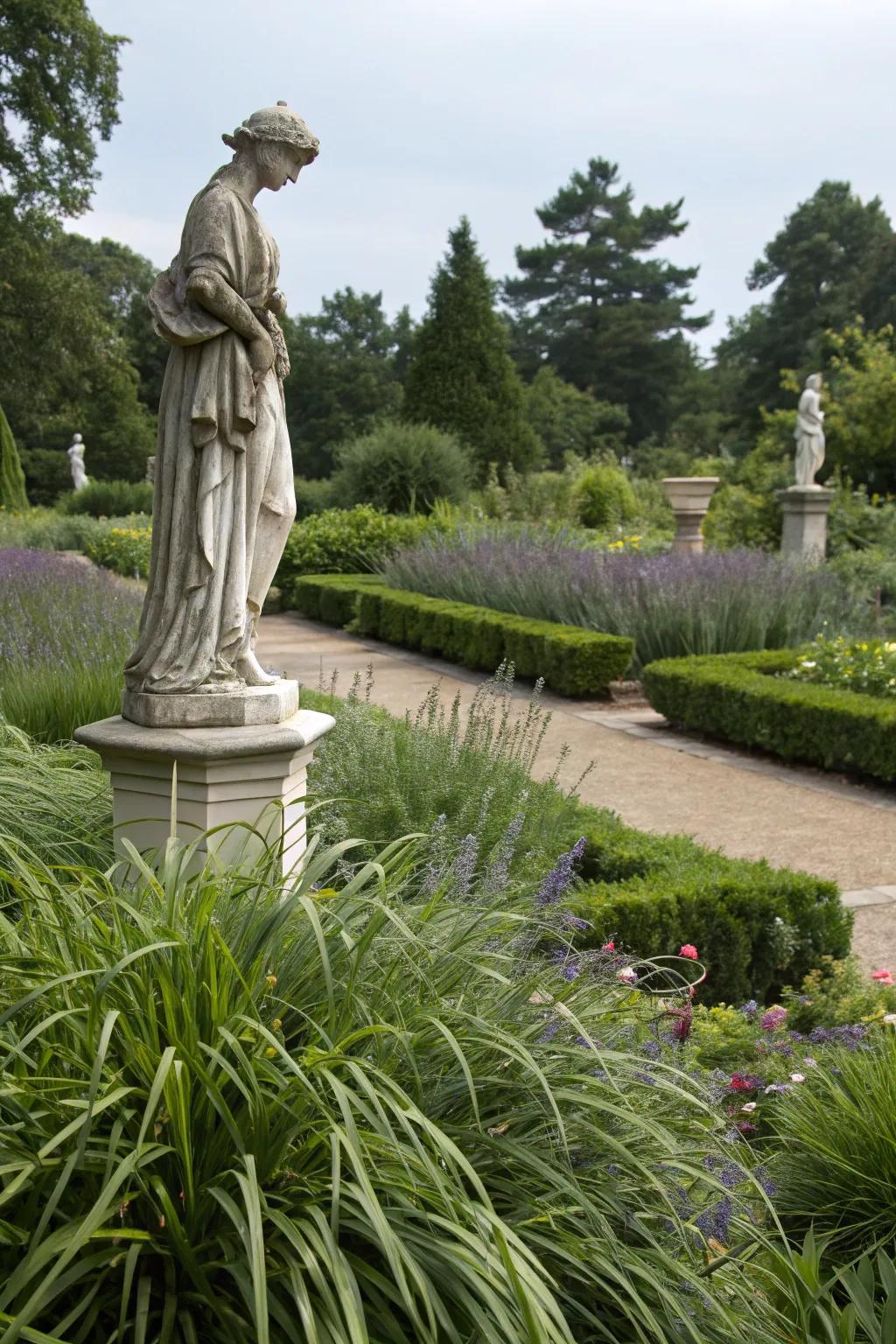 Lush liriope elegantly highlights a garden statue, enhancing its charm.
