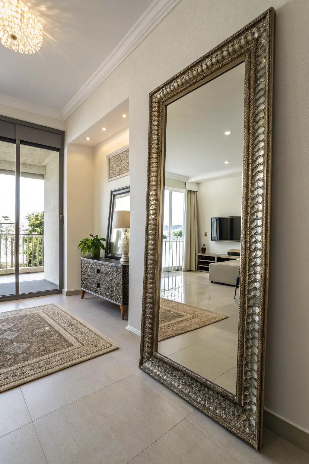 A condo with a large decorative mirror that reflects light, creating a spacious feel.