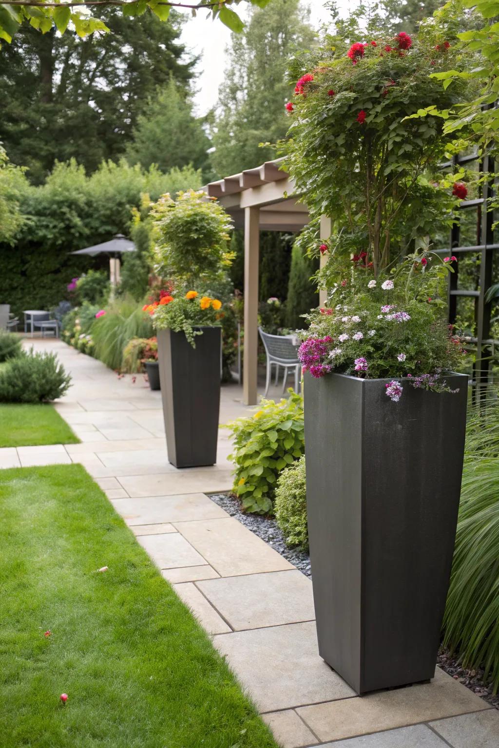 A stylish garden using tall planters to hide trash bins.