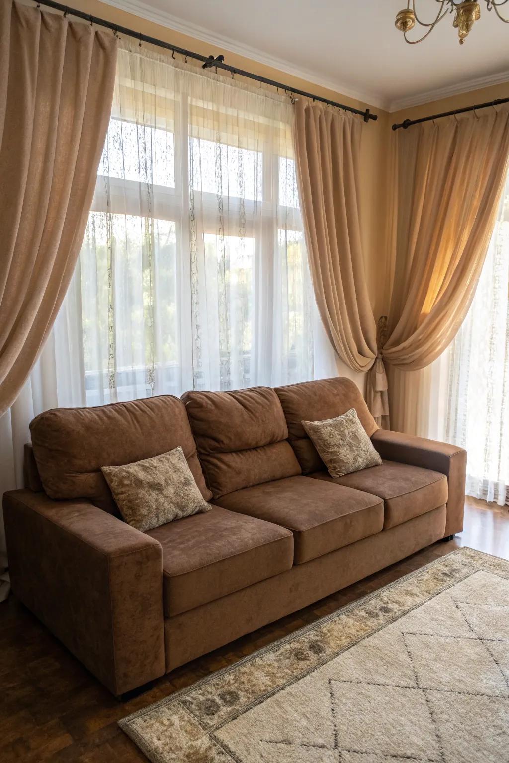 Elegant drapes frame a brown sectional, adding sophistication to the living room.
