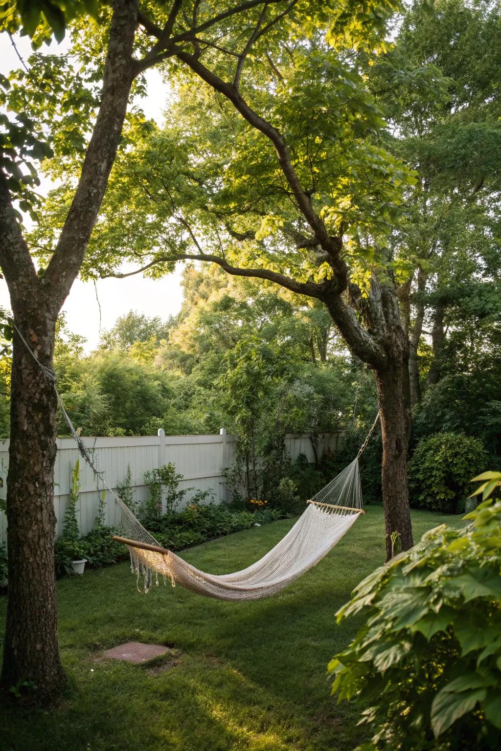 A hammock inviting relaxation in a lush backyard.