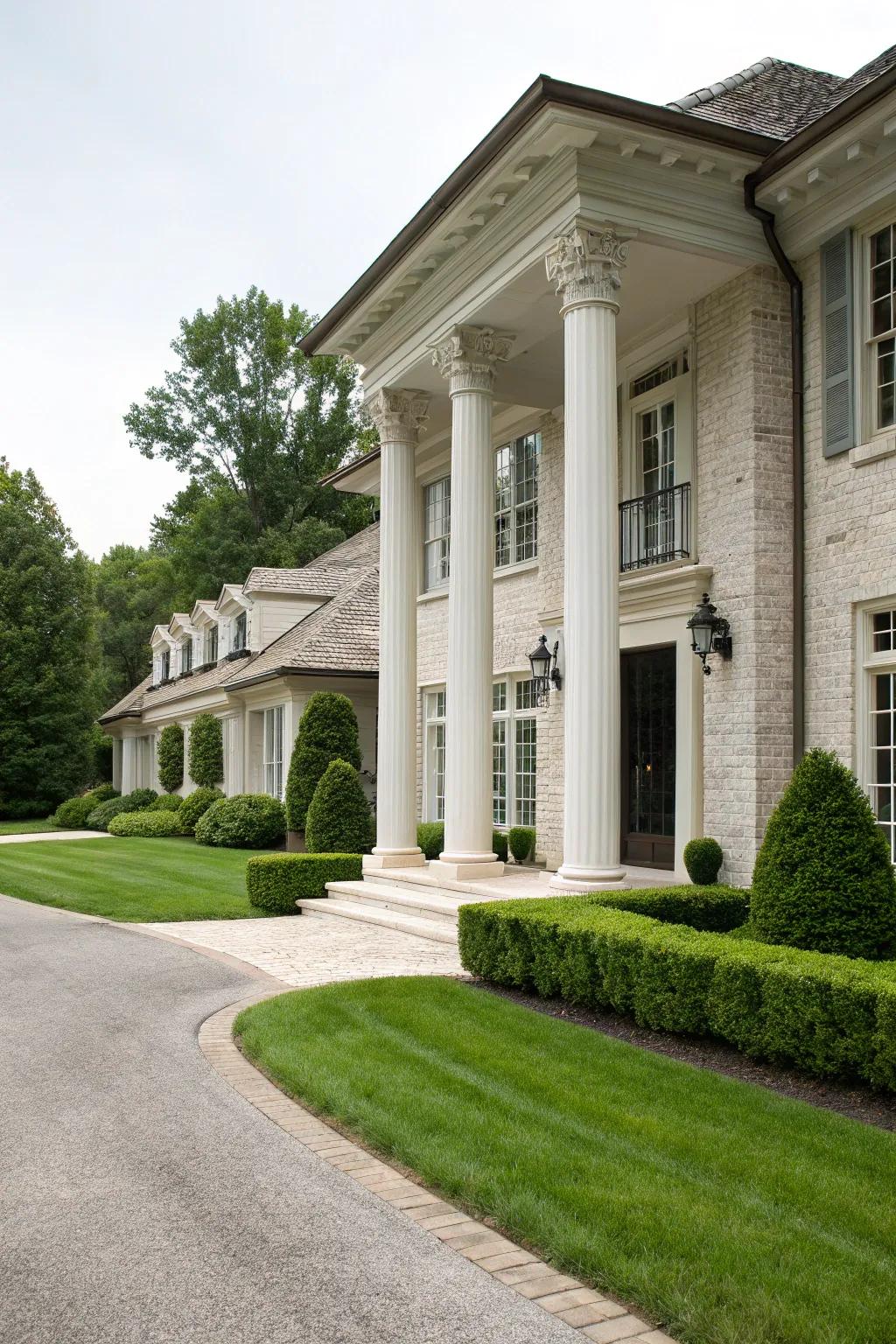 Timeless elegance with white brick and granite columns.