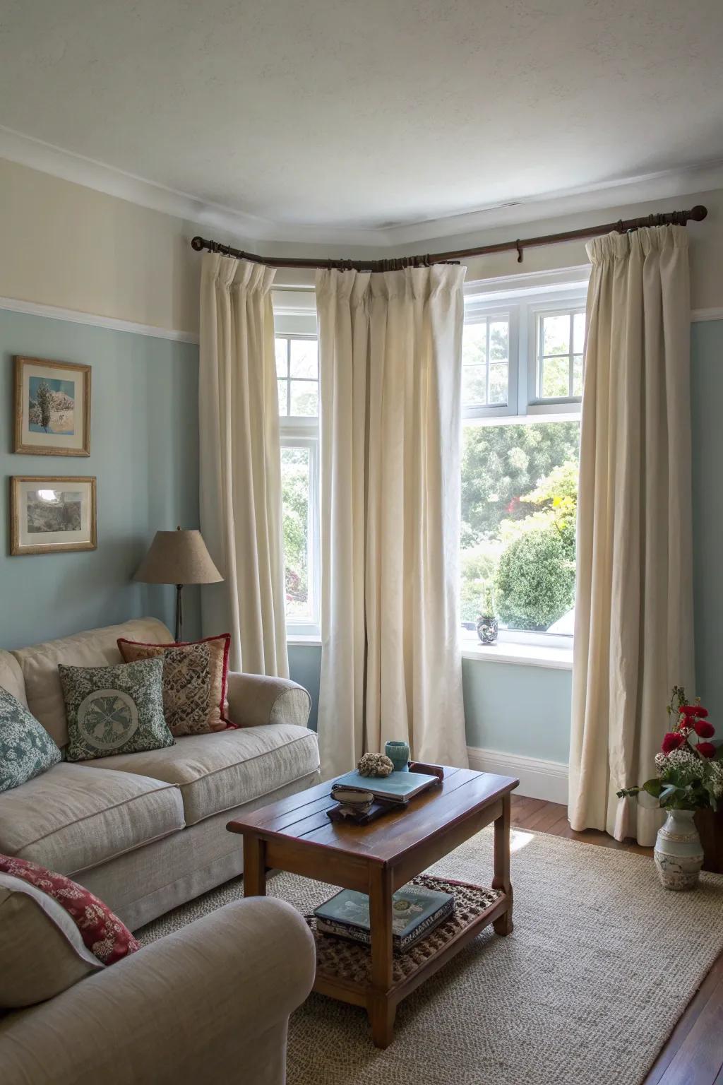 High-positioned curtains accentuate the verticality of this intimate living room.