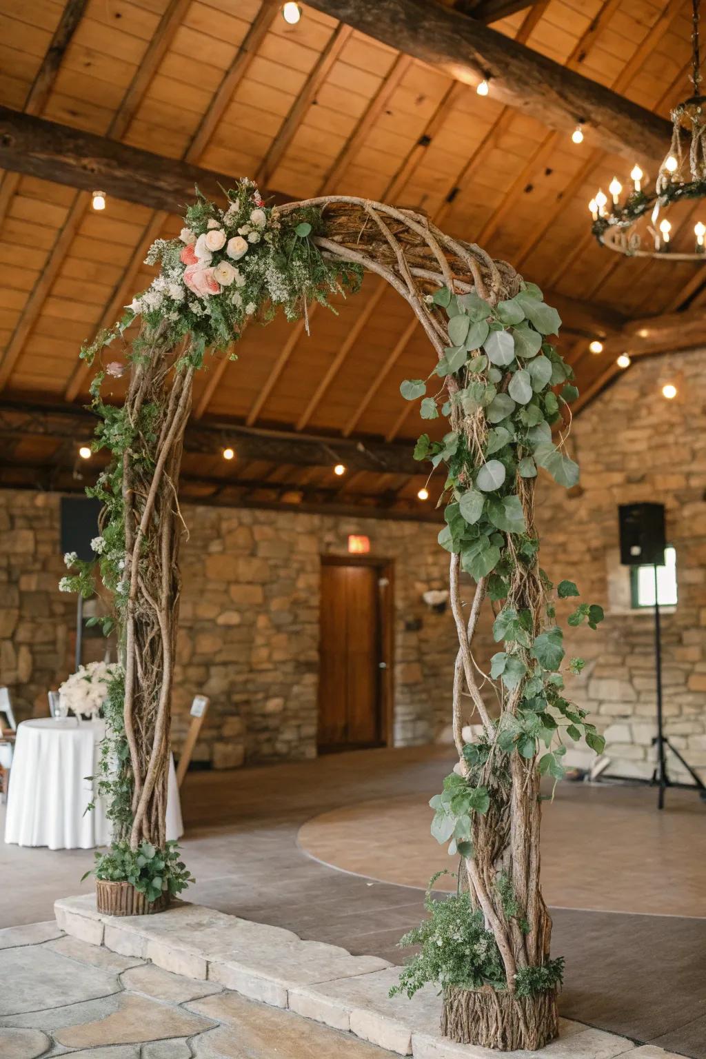 Natural branches create a rustic and organic wedding arch.