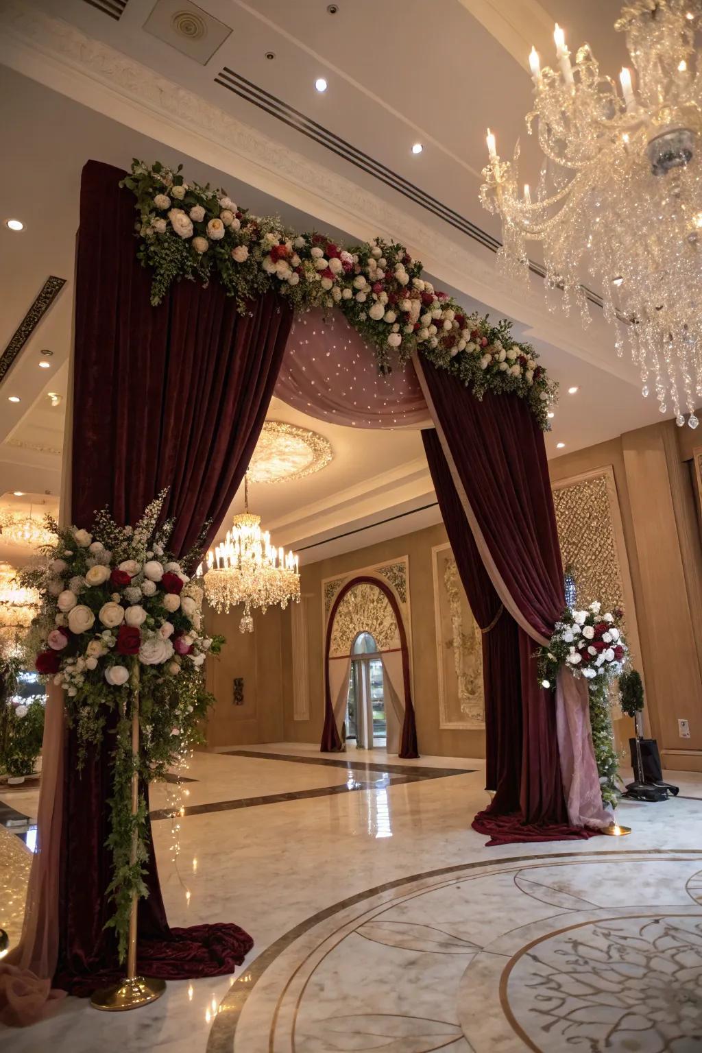 Elegant curtains add drama and sophistication to a wedding arch.