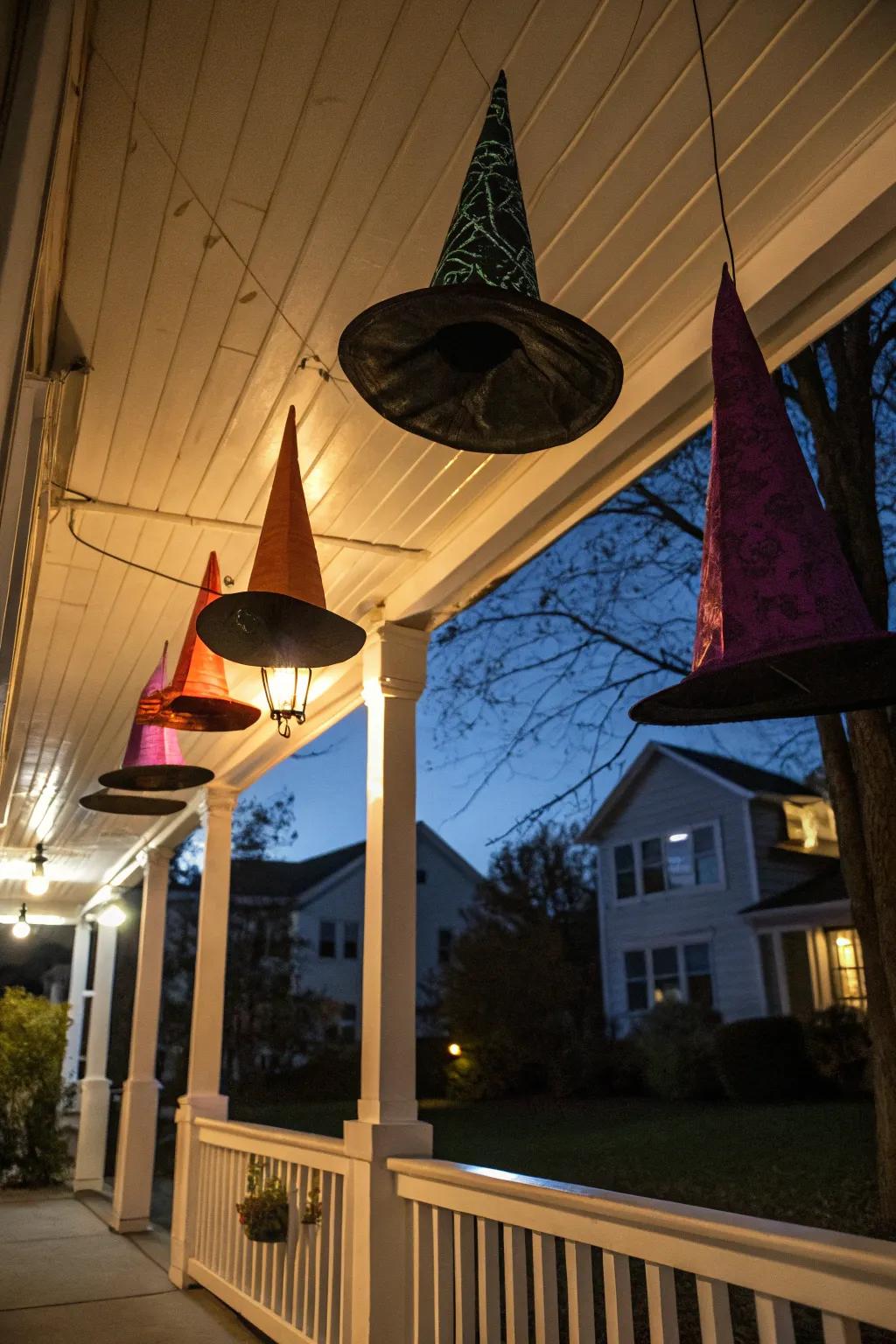 Suspended sorcerers' caps contribute a mystical vibe to this Halloween porch.