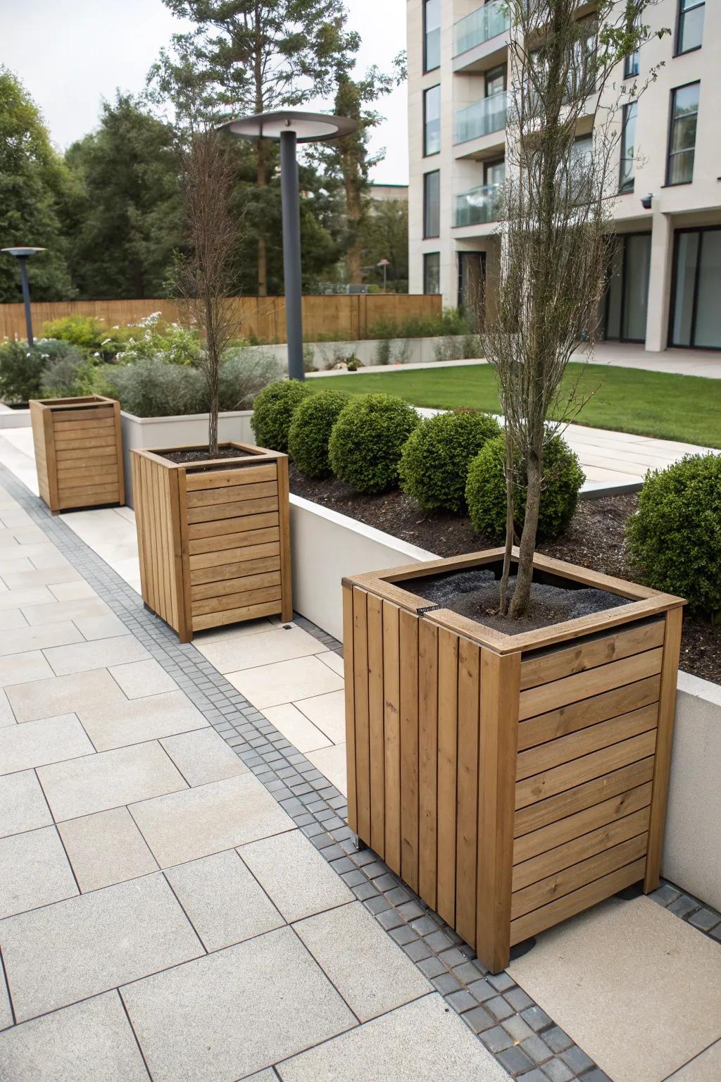 An elegant outdoor space with wooden trash bin enclosures.
