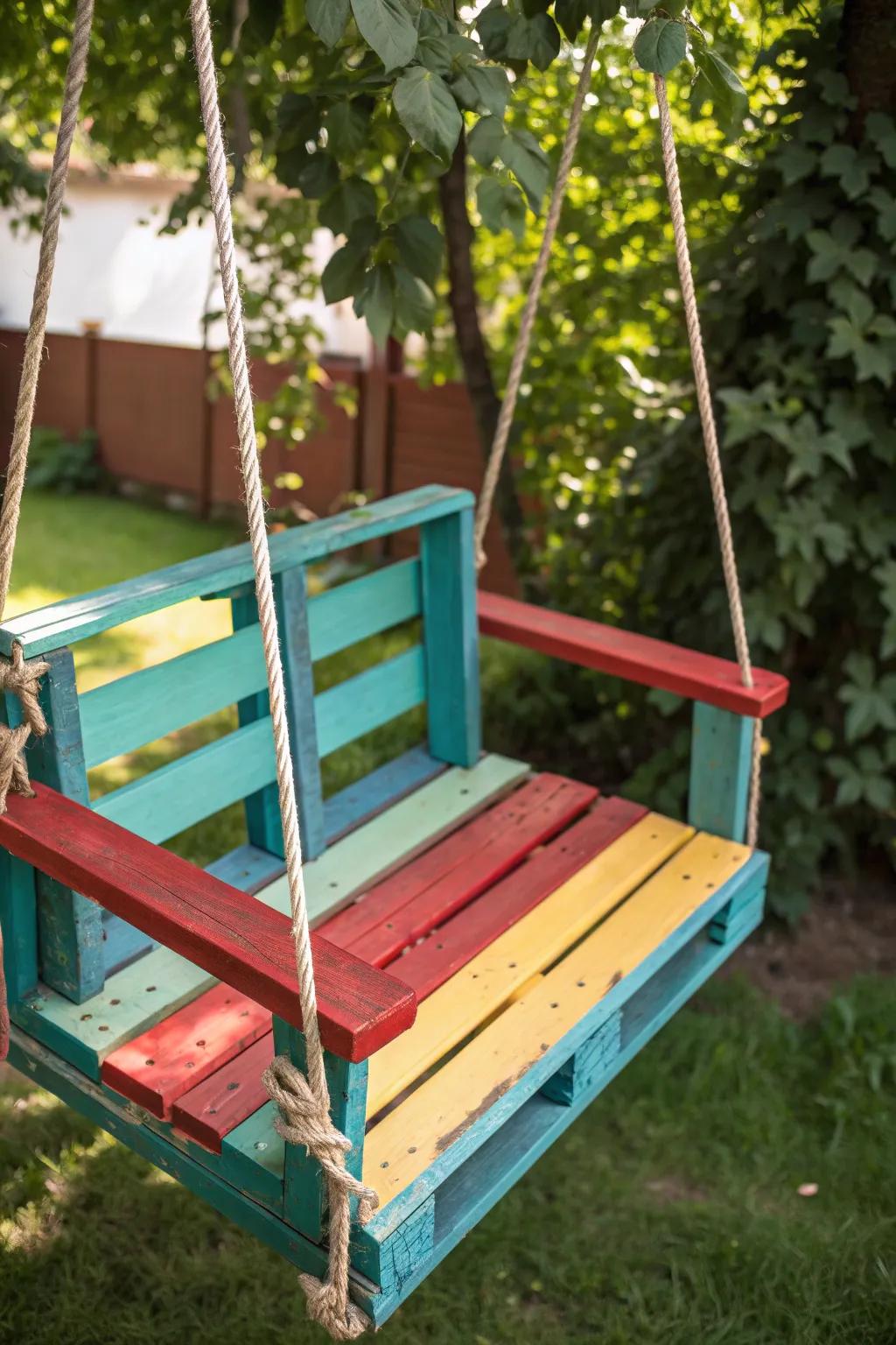 Transform your outdoor space with a vibrant pop of color and craftsmanship on this stunning pallet swing.