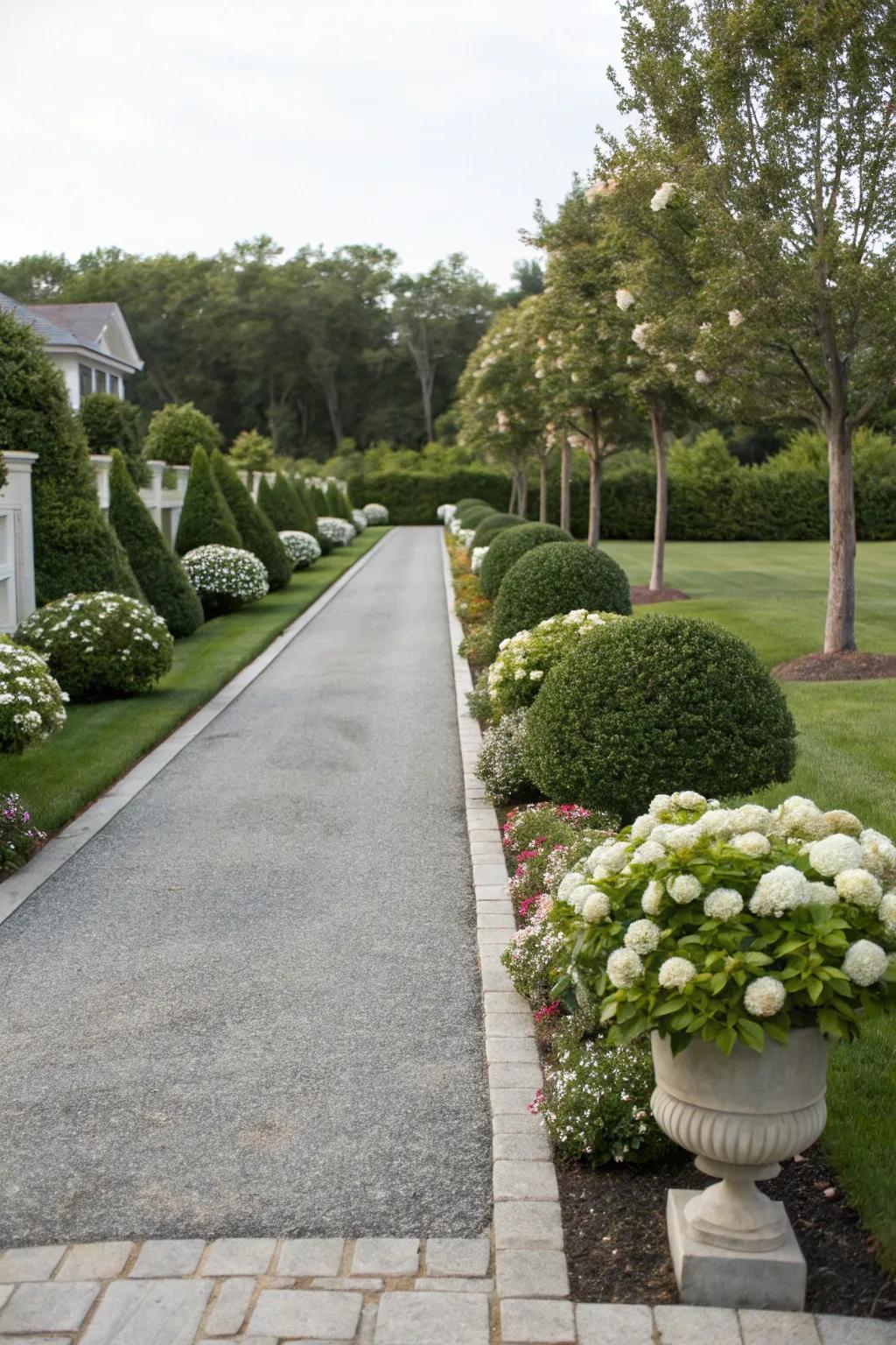 Symmetrical landscaping brings a sense of harmony to this driveway.