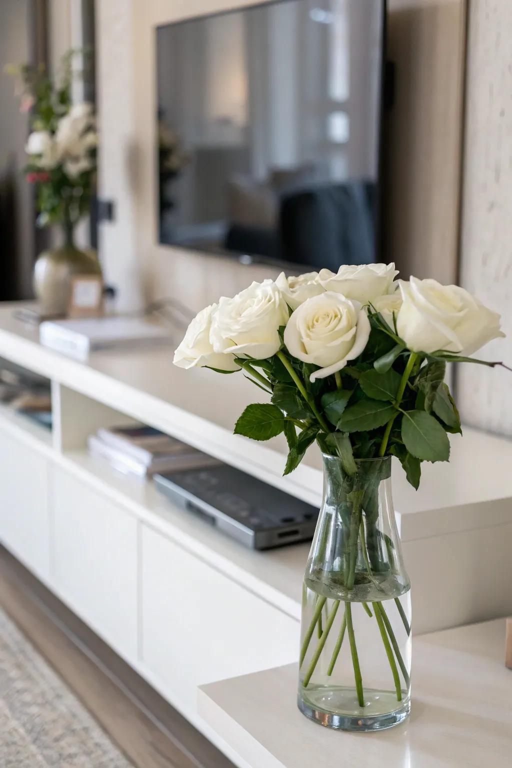 Serenity by way of minimalistic alabaster roses situated inside a transparent vase.