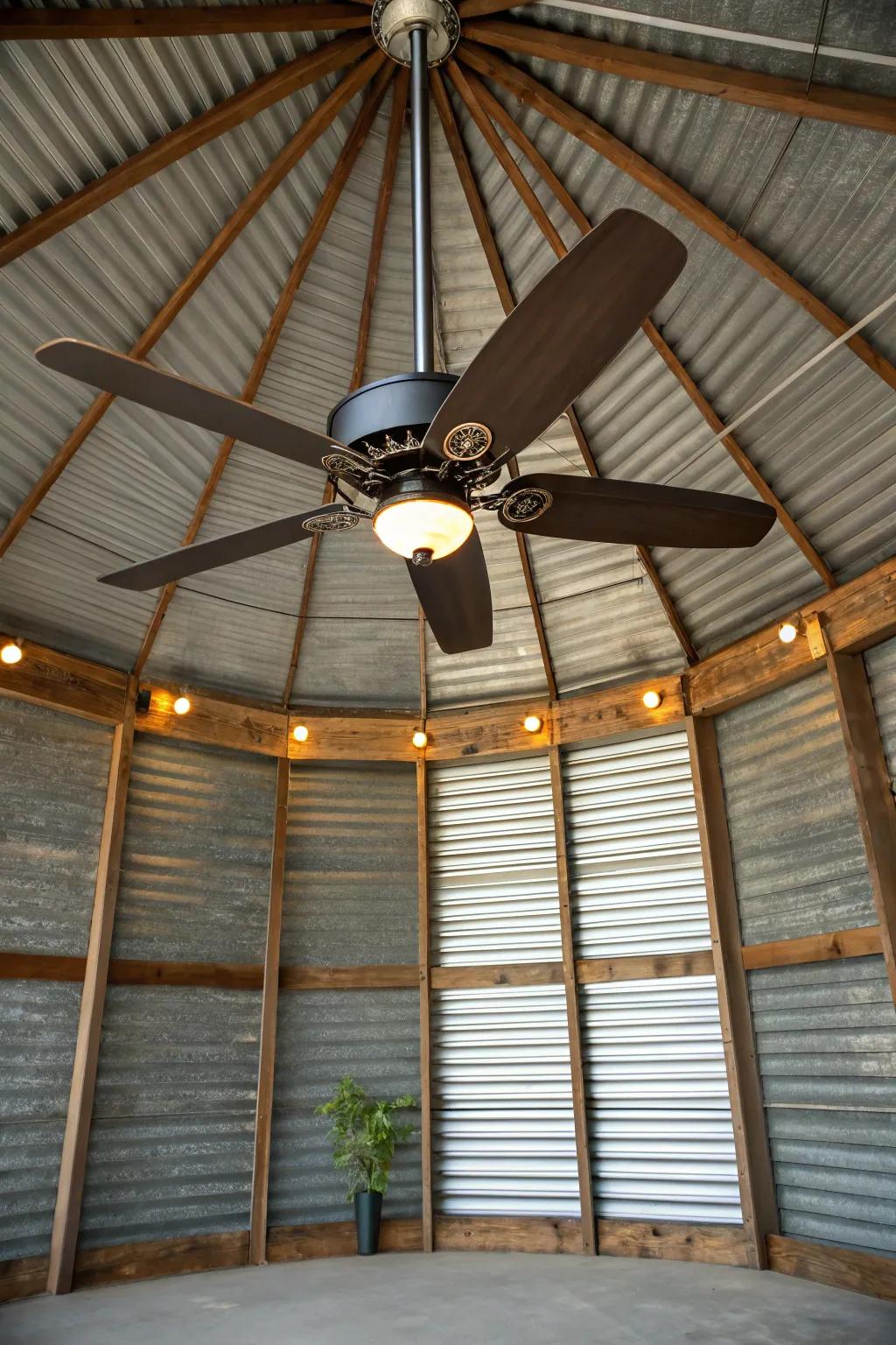 Cool comfort meets rustic charm with this sleek ceiling fan installation in a grain bin gazebo.