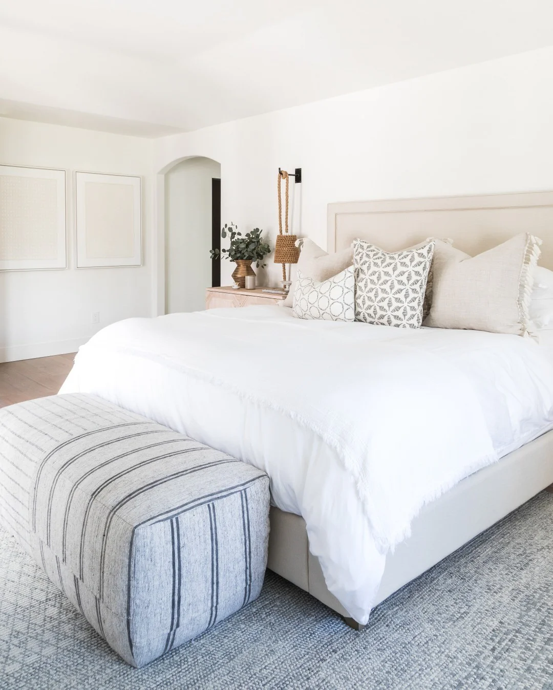 9. Contemporary White Bedroom with Neutral Layering (All White Bedroom Ideas)