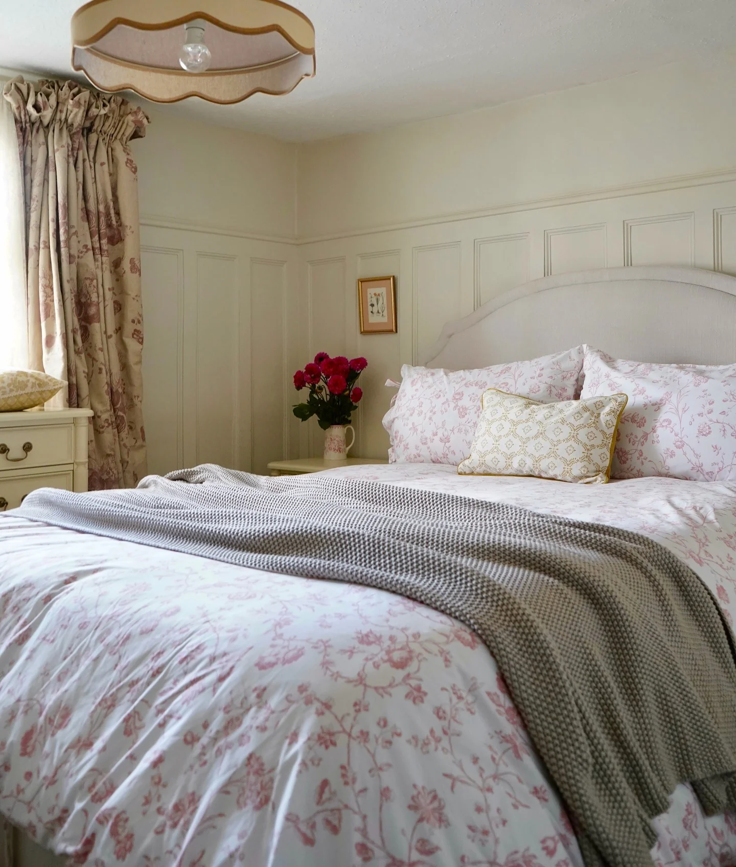10. Cream Paneling & Blush Floral Elegance (Cottage Bedroom Ideas)