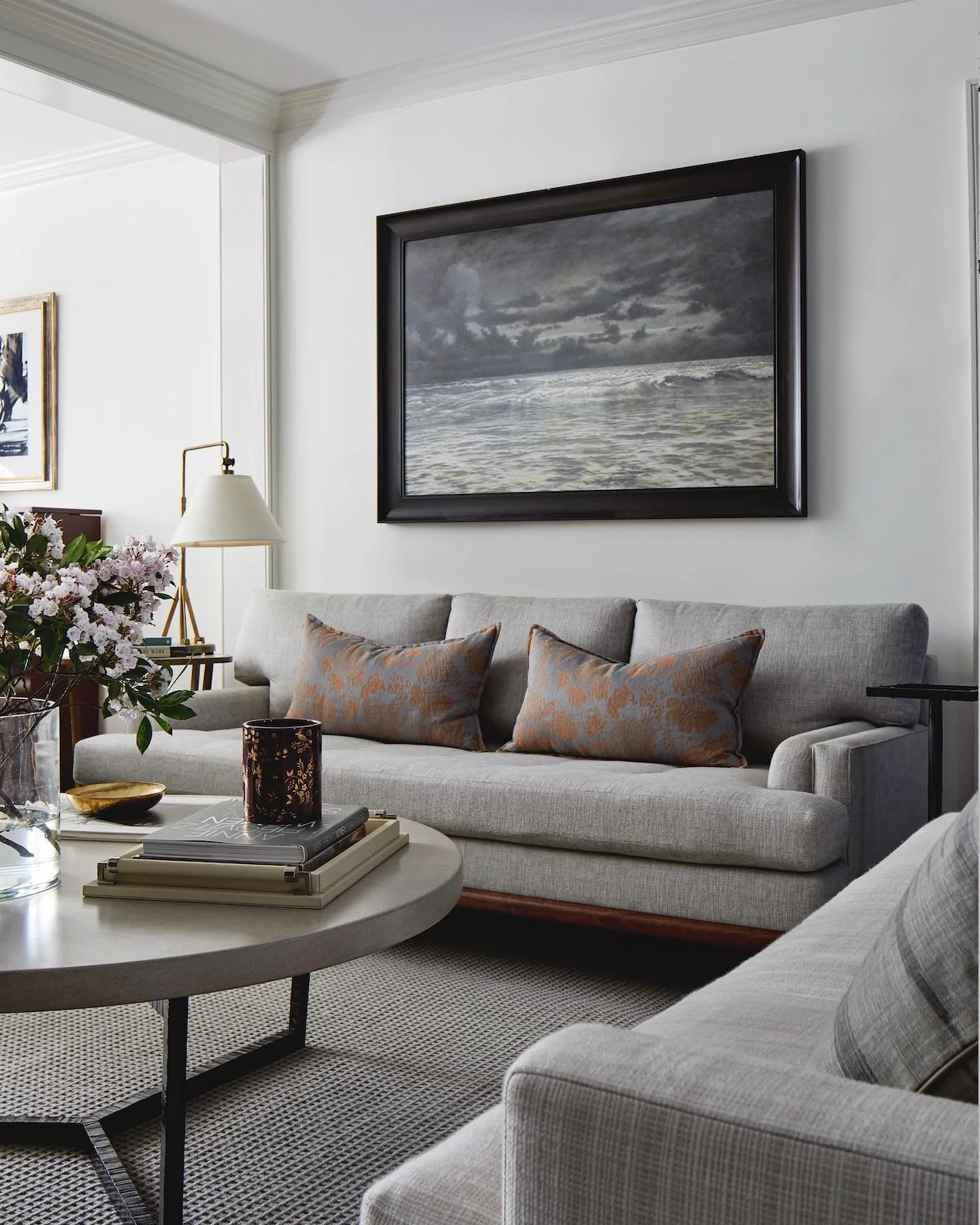5. Tailored Gray Sofa with Moody Art Backdrop (Gray Furniture Living Room Ideas)