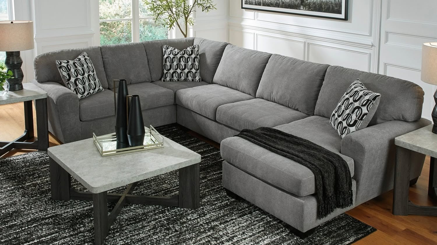 4. Modern Gray Sectional with Graphic Black Accents (Gray Furniture Living Room Ideas)