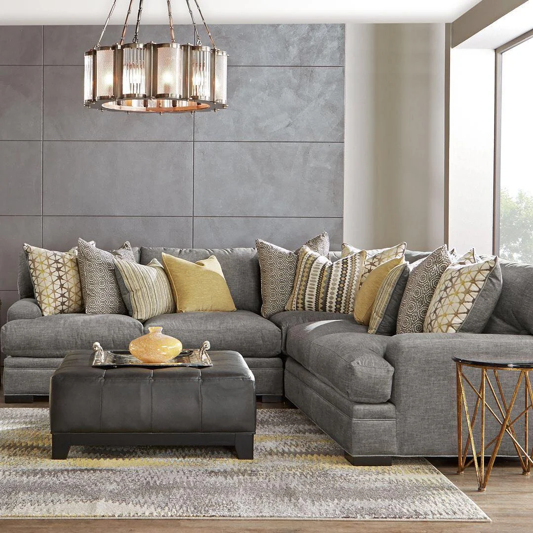 12. Refined Gray Sectional with Mustard and Metallic Highlights (Gray Furniture Living Room Ideas)