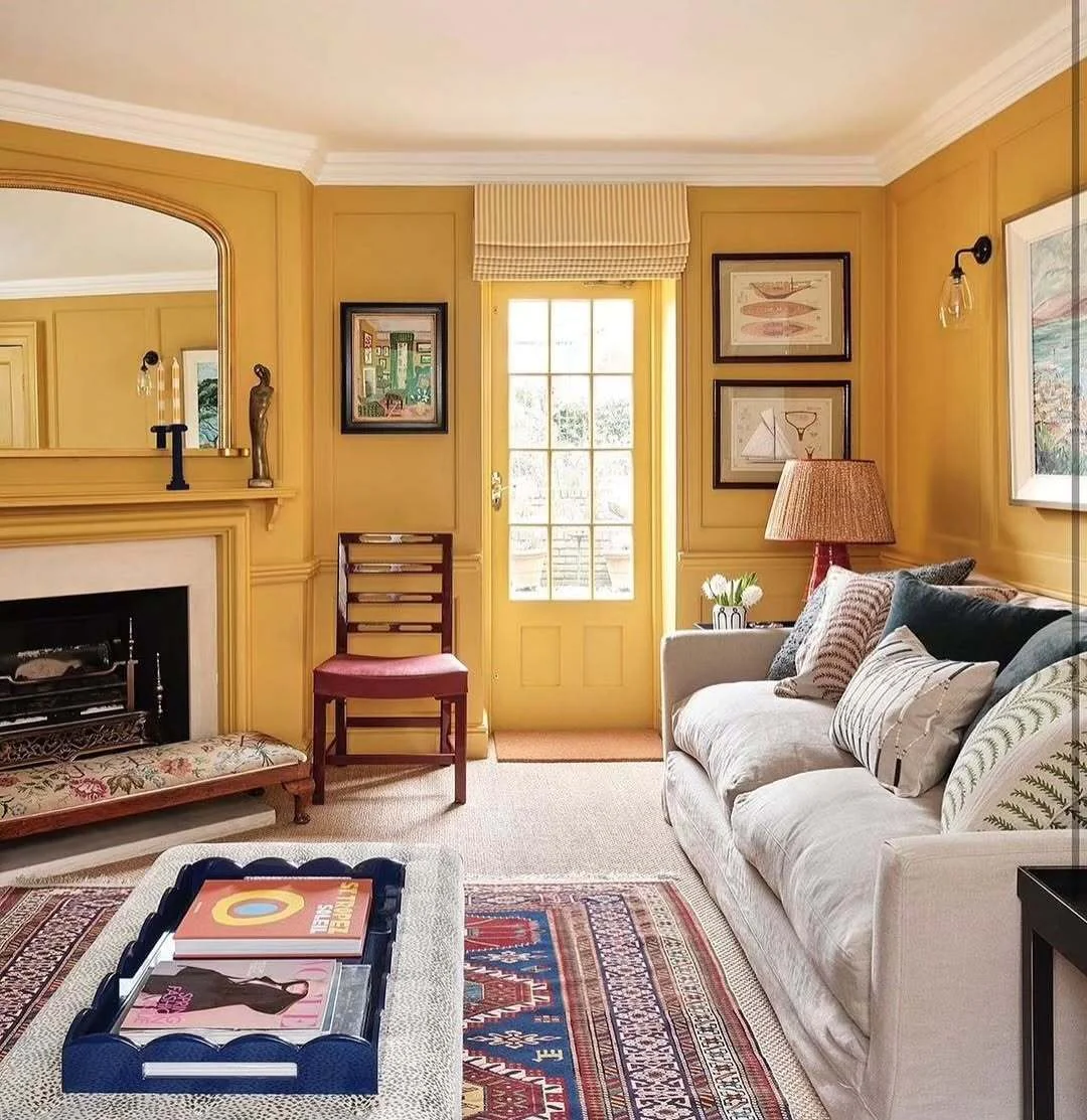 5. Classic Yellow Walls with Neutral Upholstery (Yellow and Gray Living Room Ideas)